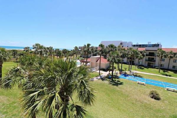 ocean village club st augustine florida with lawn and pool and buildings in background