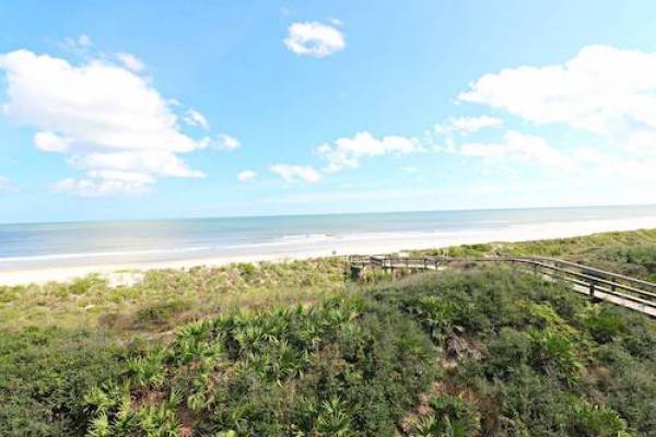 view of Atlantic Ocean from St Augustine Florida with dunes and boardwalk