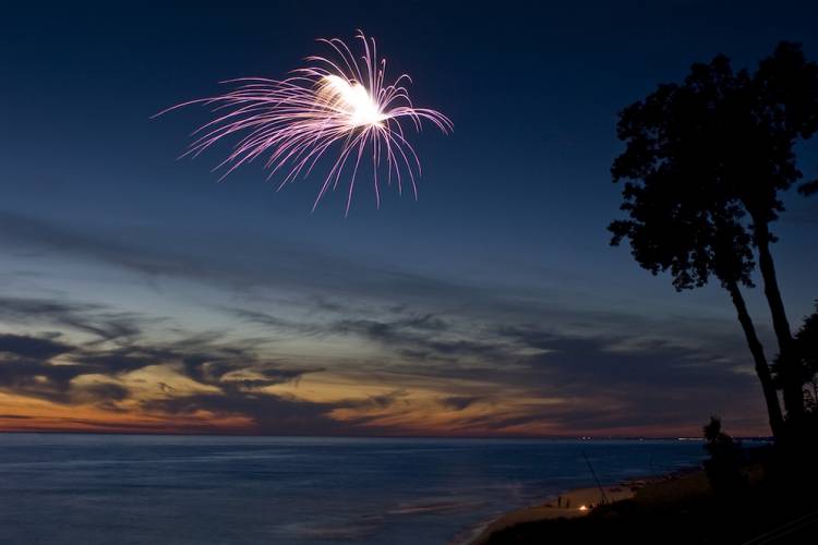 fireworks over water for 4th of July