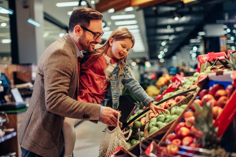 father and daughter at grocery store