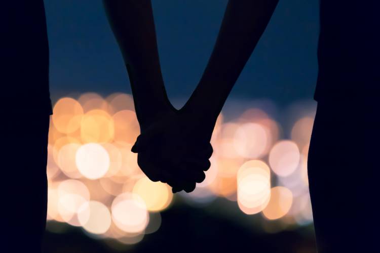 couple holding hands 