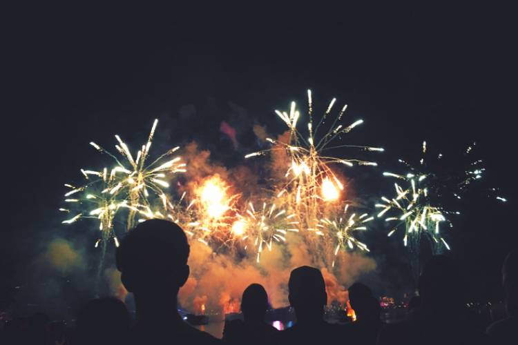 People watch the New Year's Eve firework show. 