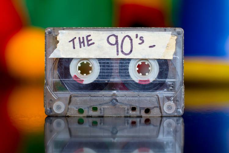 cassette tape with sticker on it that says The 90's.