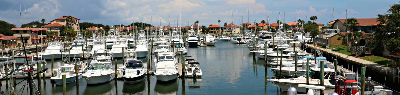 view of camachee harbor at the inn with lines of boats and yachts in the water