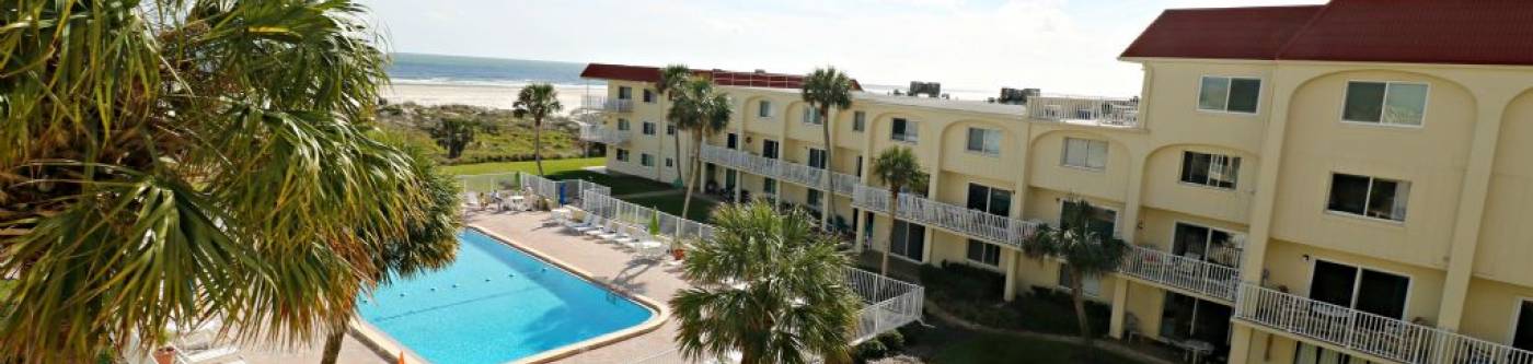 spanish trace view of pool and resort from above with atlantic ocean in background